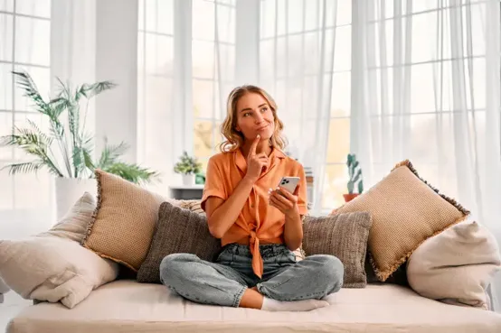 Person in thought while holding phone